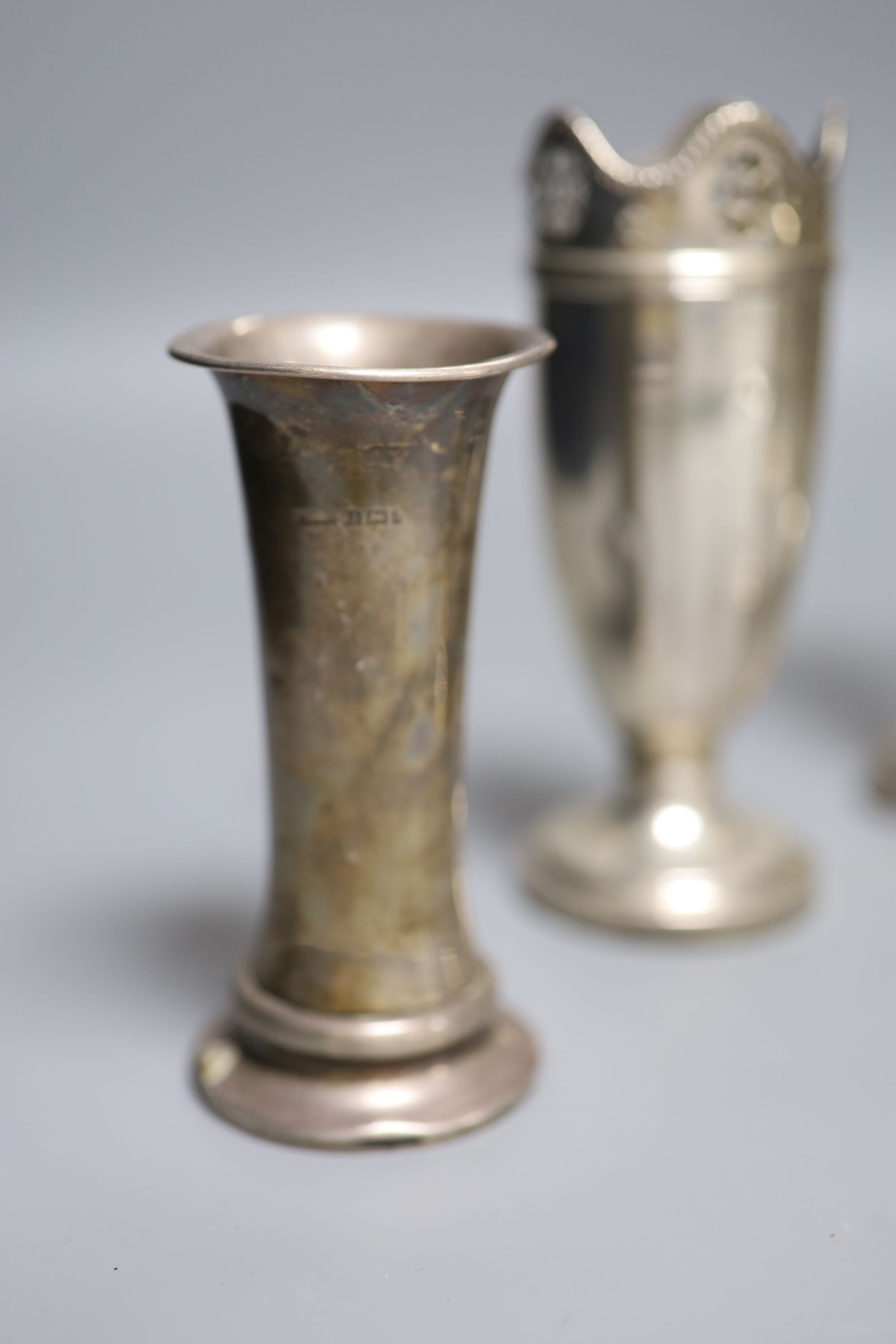 Seven assorted Victorian and later silver posy vases, largest 16.5cm, all weighted.